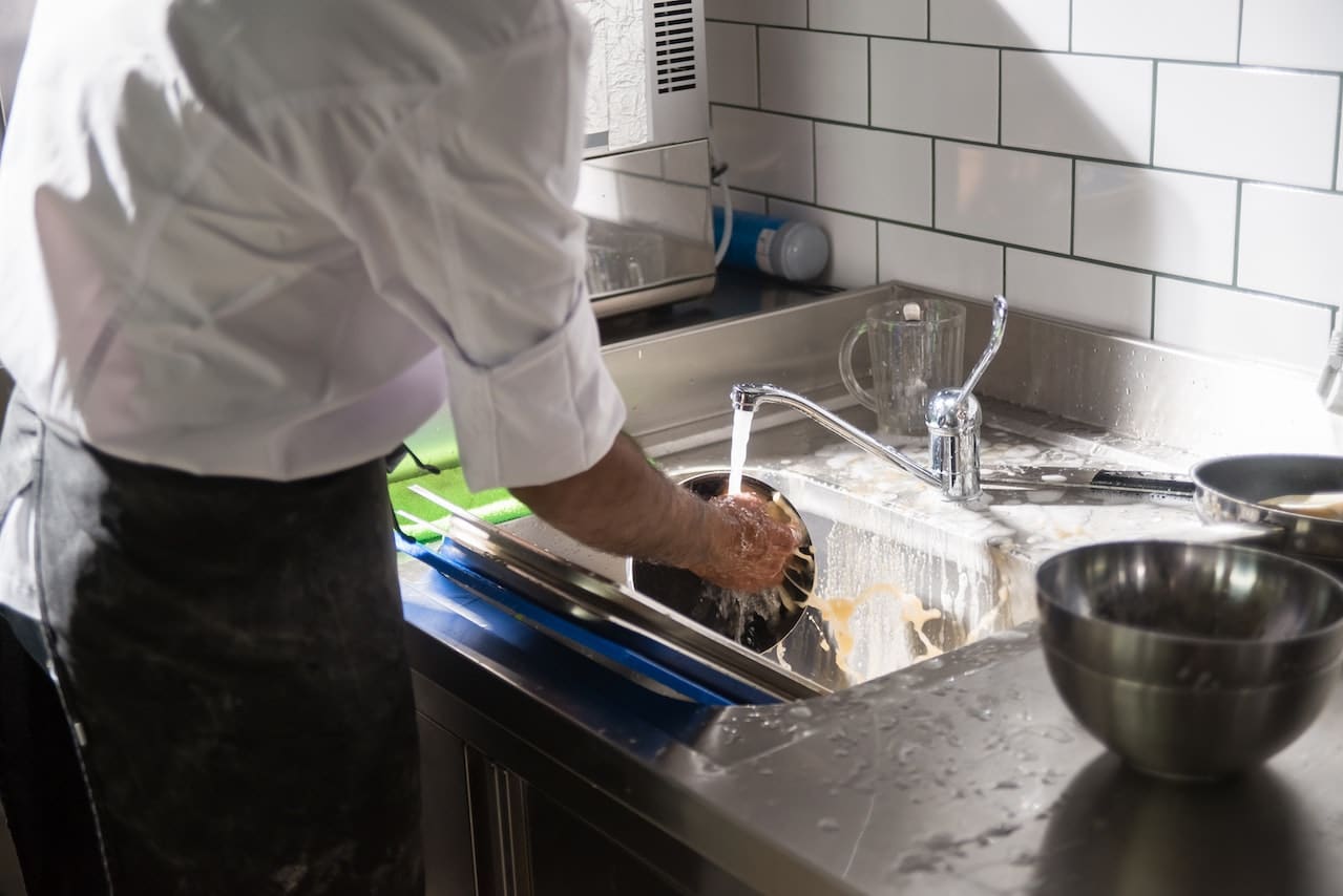 Person cleaning dishes