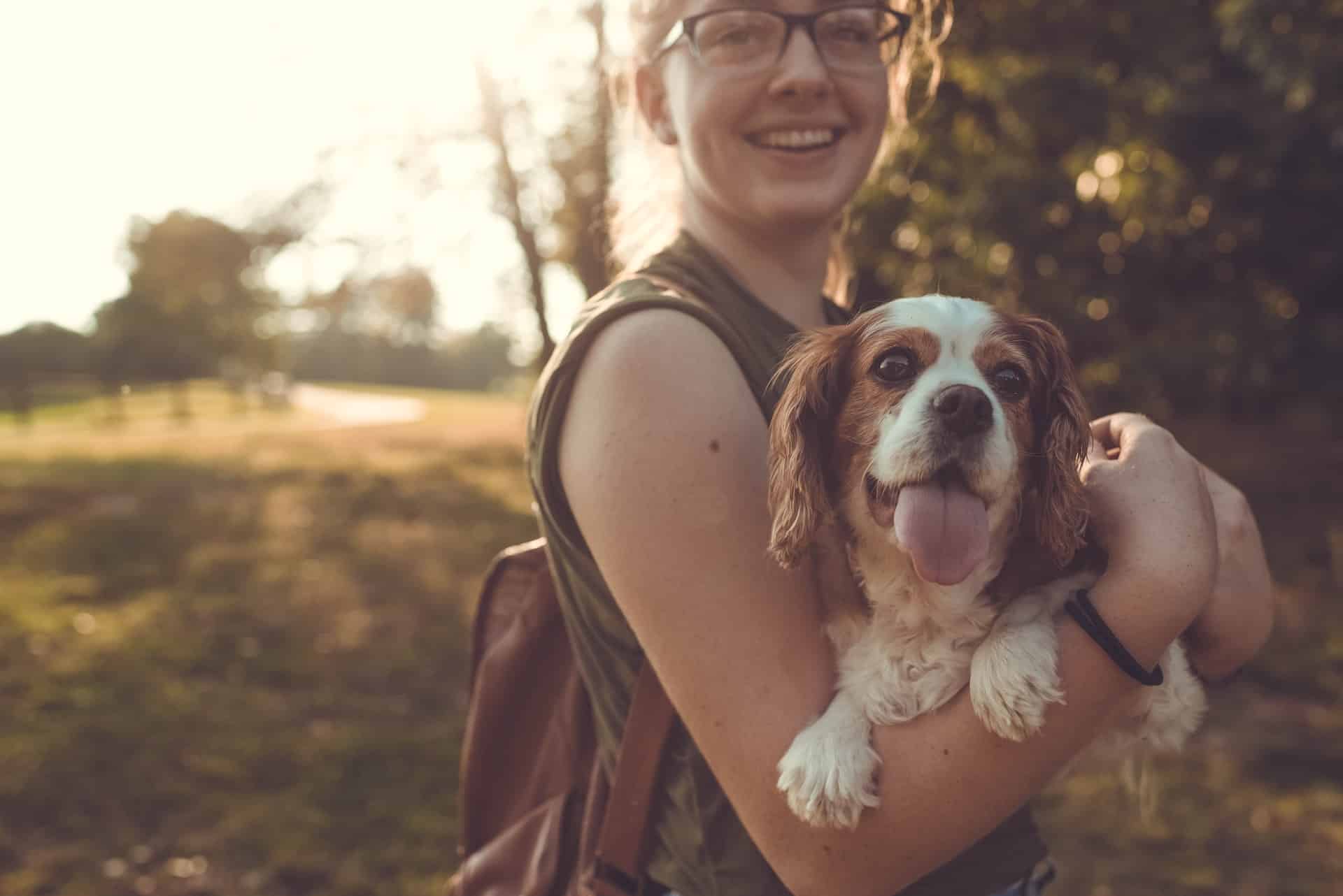 Girl holding a dog