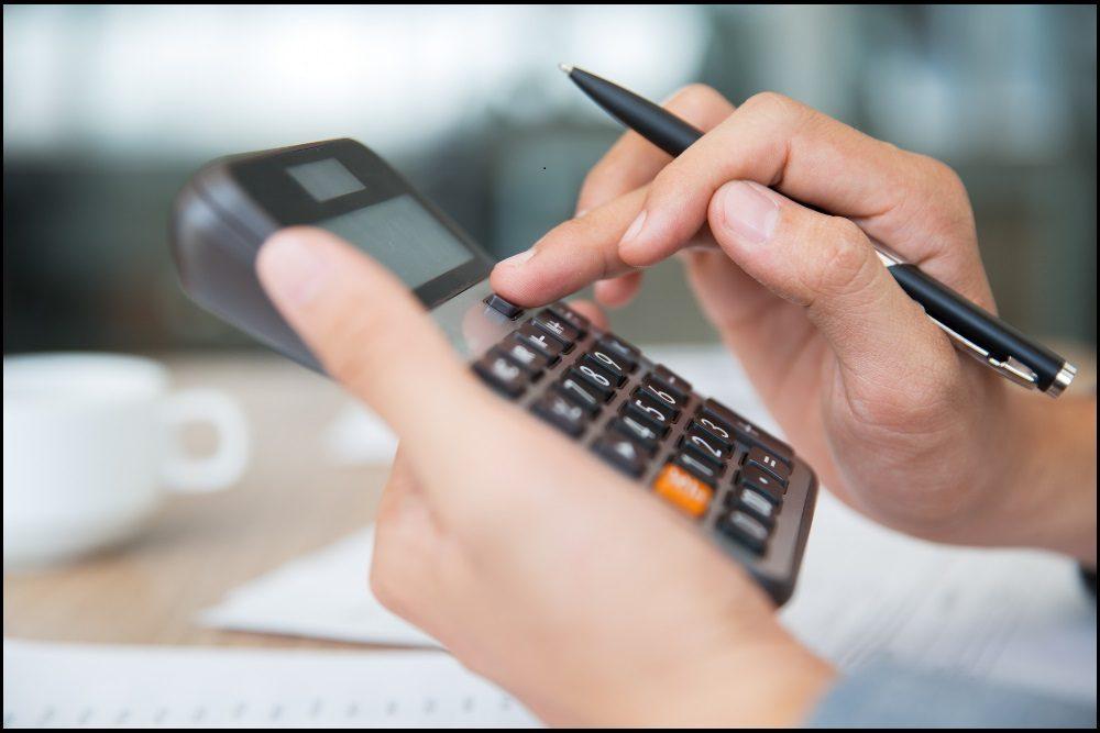 Person holding a calculator