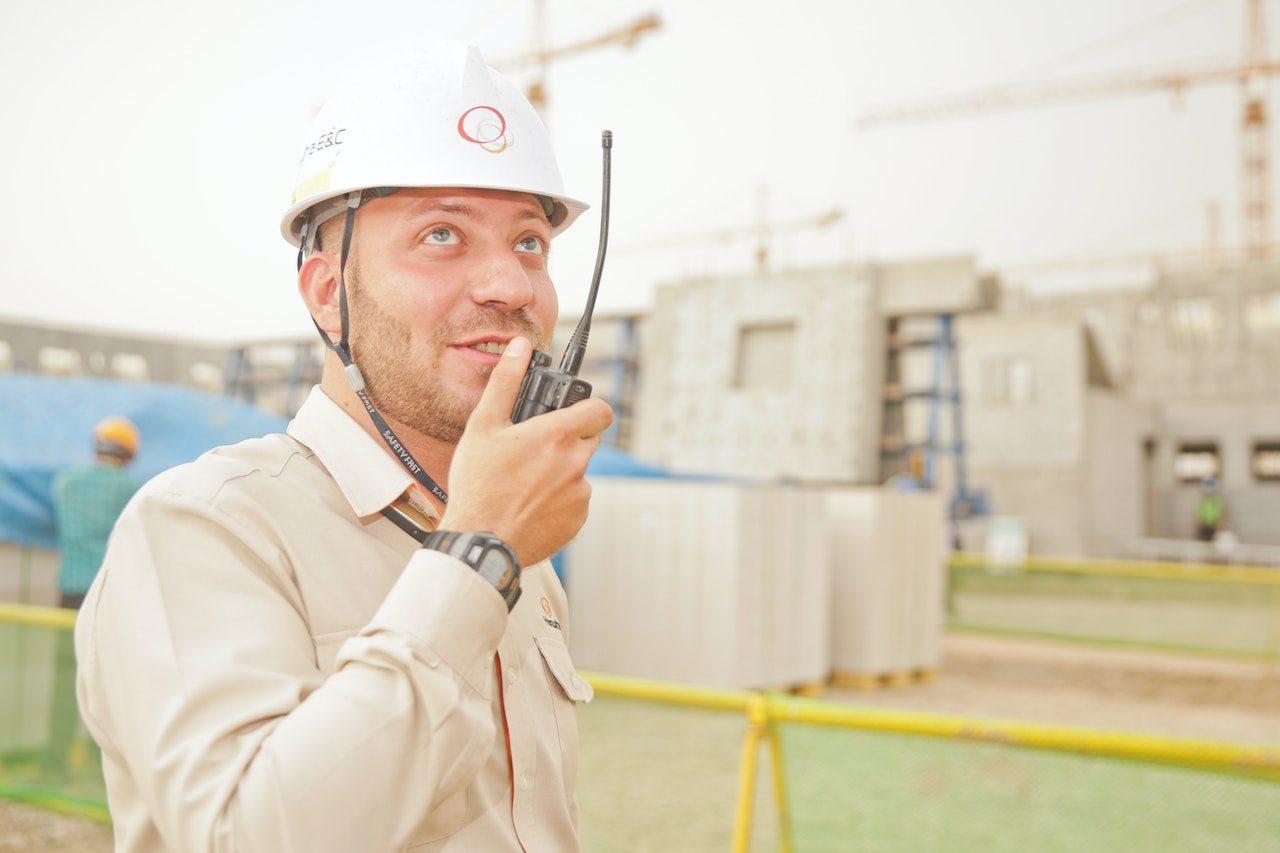 Person holding 2 way radio