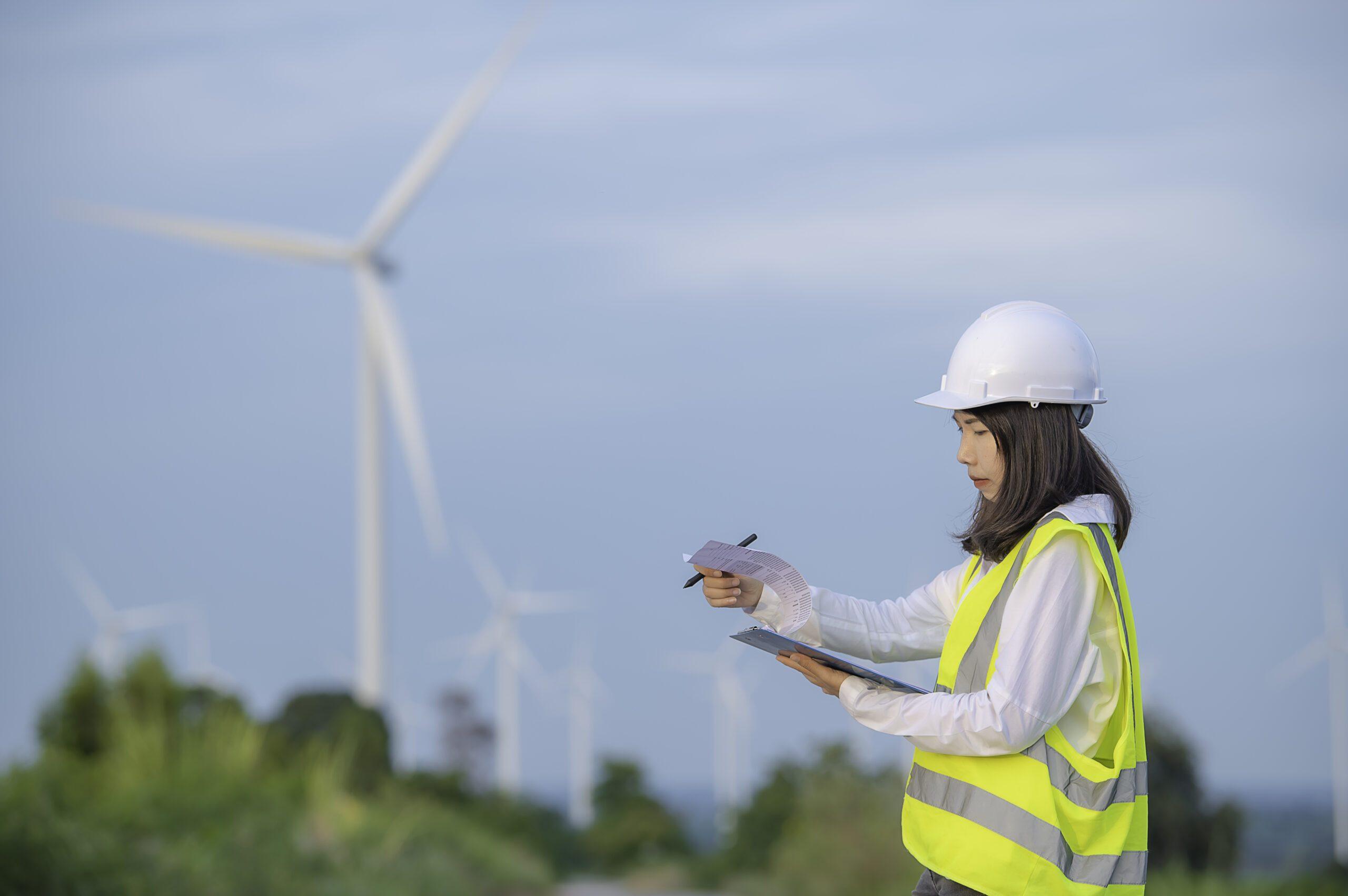 Woman working in wind turbine farm