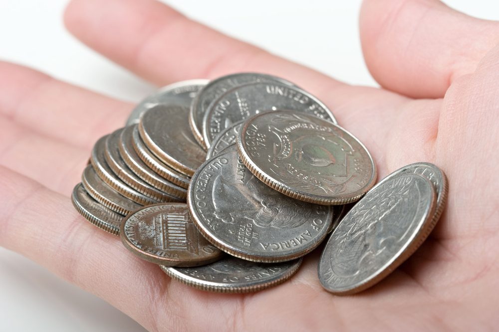 Jan23 person holding coins | Quarters Worth Money