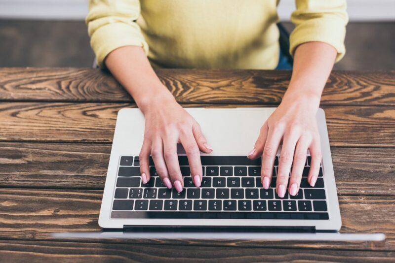 Person typing on laptop