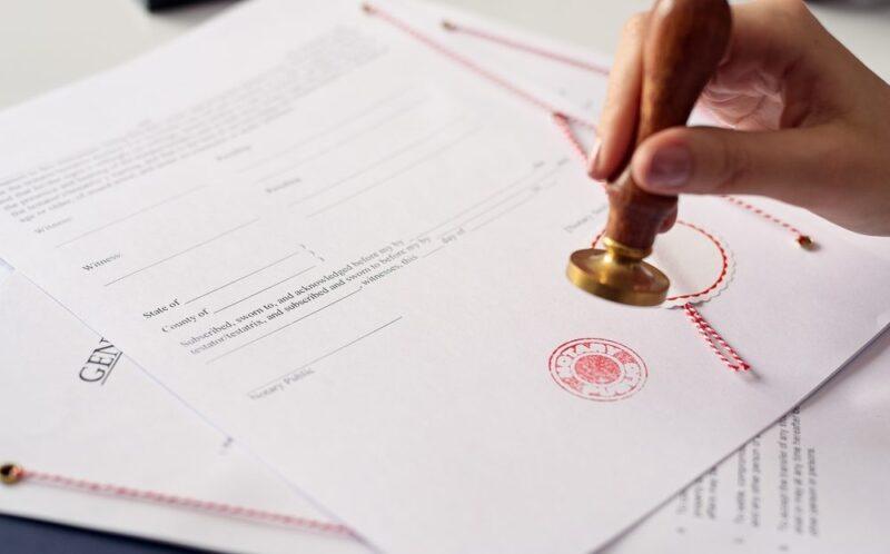 woman stamping a document