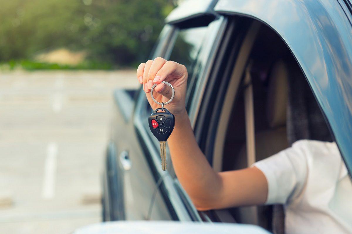 Person holding car key