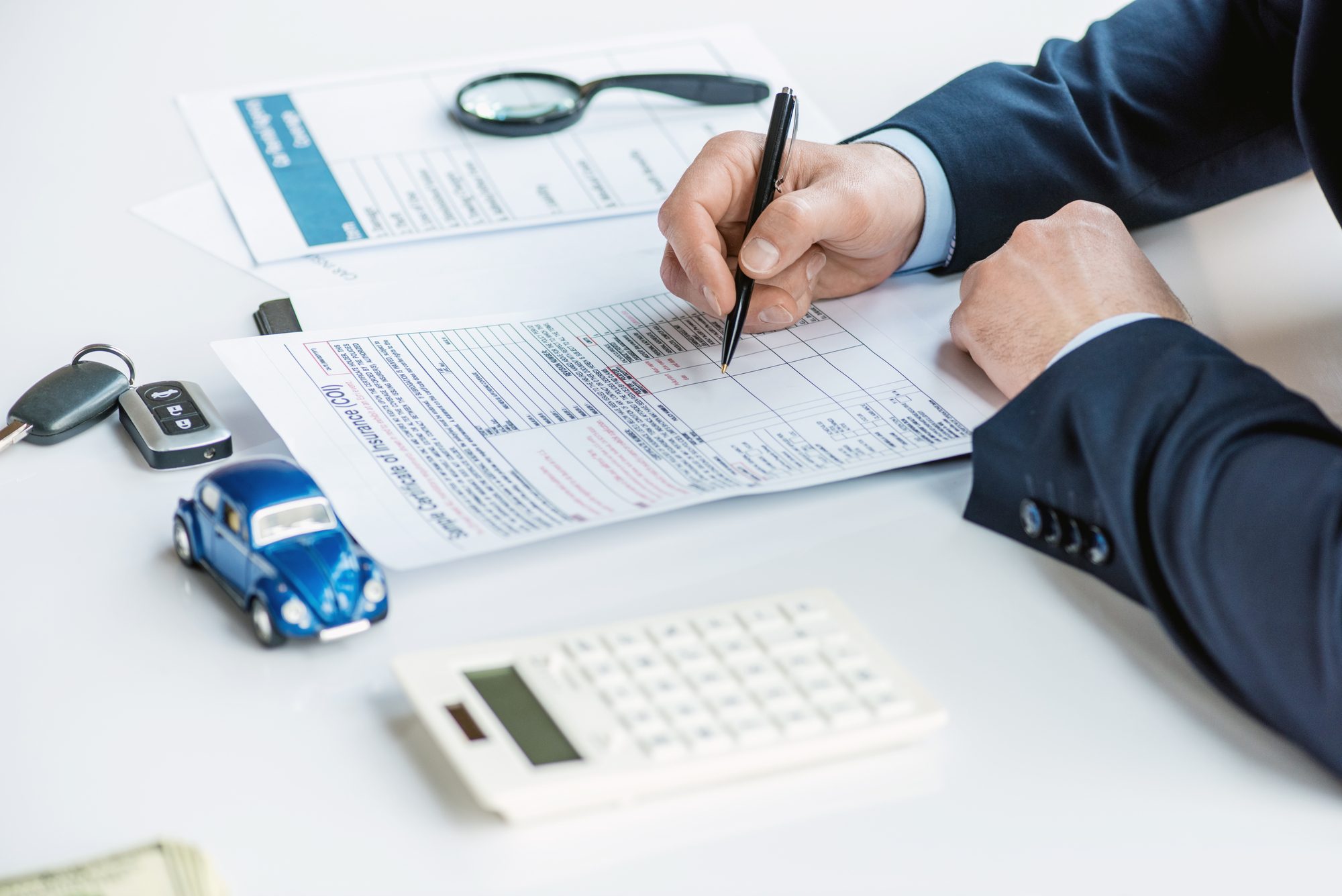 Person signing insurance papers